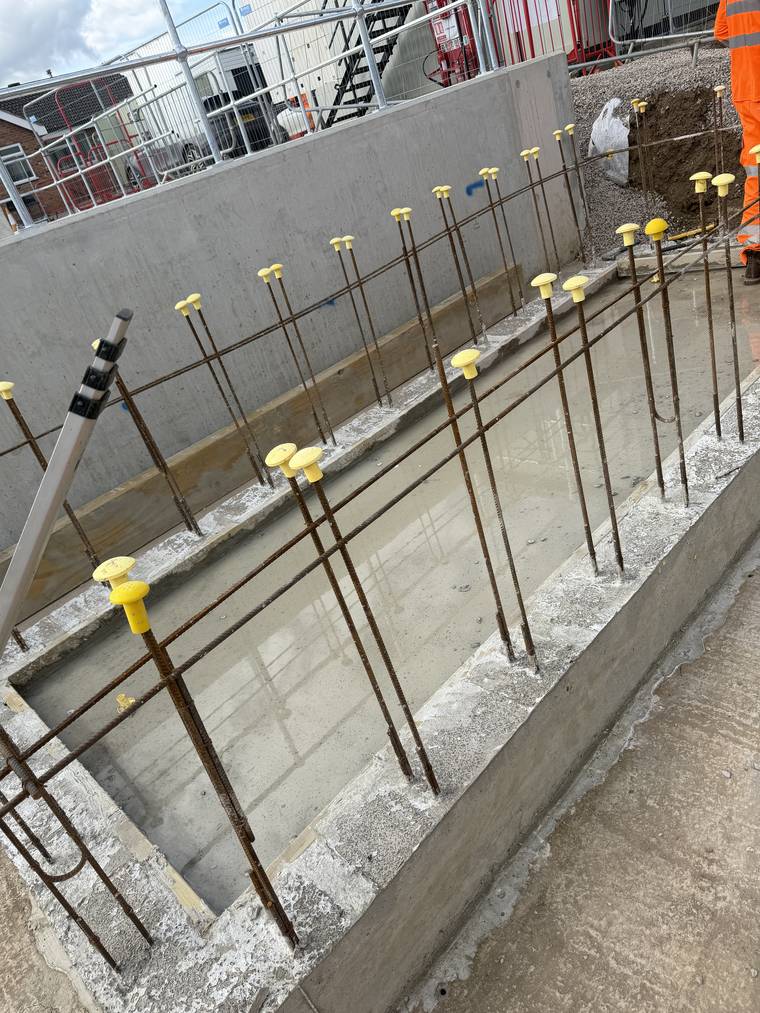In-situ concrete pit walls with capped starter bars projecting for the following lift.